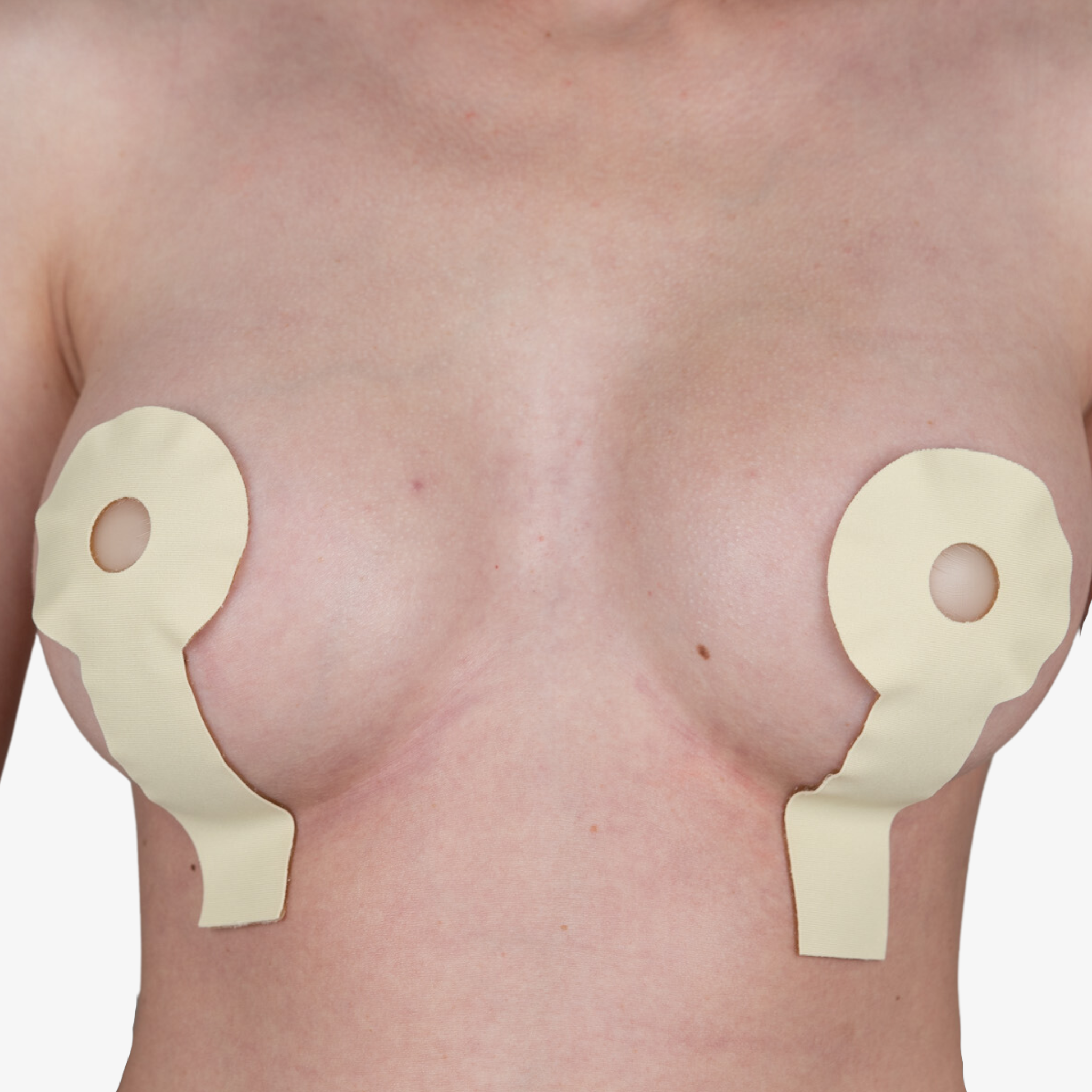 Advanced Medical-Grade Silicone Breast Lollypop Sheet on caucasian women's breast close up | beige