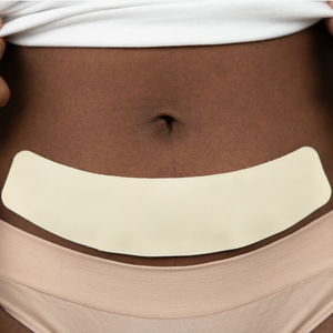Advanced Medical-Grade 2" X 8" C-Section Strip on black women's stomach | beige